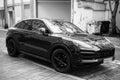 Front view of black Porsche cayenne parked in the street