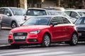 Front view of red Audi A1 parked in the street, Audi is the famous german brand of cars