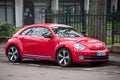 Front view of red Volkswagen new beetle Parked in the street Royalty Free Stock Photo