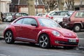 Front  view of red Volkswagen new beetle Parked in the street Royalty Free Stock Photo