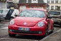 Front view of red Volkswagen new beetle Parked in the street Royalty Free Stock Photo