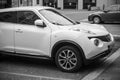 Front view of white Nisssan Juke crossover parked in the street Royalty Free Stock Photo