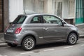 Grey fiat 500 parked in the street