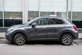 Profile view of grey Fiat 500x parked in the street