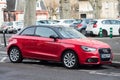 Profile view of red Audi A1 parked in the street, Audi is the famous german brand of cars