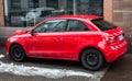 Profile view of red Audi A1 parked in the street, Audi is the famous german brand of cars