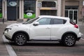 Profile view of white Nisssan Juke crossover parked in the street Royalty Free Stock Photo