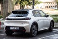 Rear view of white Peugeot e208 parked in the street, Peugeot is the famous french brand of cars of the psa group