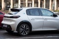 Rear view of white Peugeot e208 parked in the street, Peugeot is the famous french brand of cars of the psa group