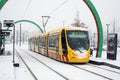 yellow tramway by the Solea compagny rolling during a snowy day