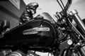 Closeup of black tank on Harley Davidson motorbike parked in the street Royalty Free Stock Photo