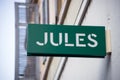 Jules logo on the signboard on store front in the street