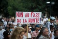 people protesting in the street against the sanitary pass, with banner in french, non au pass de la honte, in english , no pass o