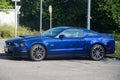 Profile view of blue Ford Mustang 500 GT parked in the street Royalty Free Stock Photo