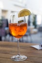 Glass of spritz with lemon slice on restaurant terrace Royalty Free Stock Photo