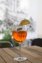 Glass of spritz with lemon slice on restaurant terrace Royalty Free Stock Photo