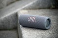 grey portable JBL subwoofer speaker on stoned stairs in the street Royalty Free Stock Photo
