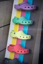 Plastic colorful shoes collection by crocs in a fashion store showroom
