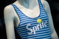 Sprite logo on blue stripped swimsuit on mannequin  in fashon store showroom Royalty Free Stock Photo