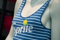 Sprite logo on blue stripped swimsuit on mannequin  in fashon store showroom Royalty Free Stock Photo