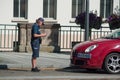 Police woman writing a minutes for a parked car Royalty Free Stock Photo