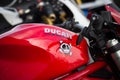 Ducati monster sign on red tank of motorbike parked in the street Royalty Free Stock Photo