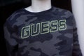 Closeup of guess tee-shirt on mannequin in a fashion store showroom