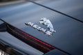 Jaguar logo on black car parked in the street Royalty Free Stock Photo