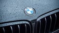 Rain drops on black BMW car front parked in the street Royalty Free Stock Photo