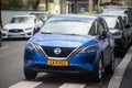 Front view of blue Nissan qashqai parked in the street