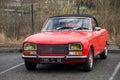 Front view of orange peugeot 304 convertible parked in the street Royalty Free Stock Photo