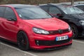 Front view of red Volkswagen Golf GTI parked in the street Royalty Free Stock Photo