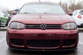 Front view of red Volkswagen golf 4 r32 parked in the streetby rainy day Royalty Free Stock Photo