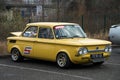 Front view of yellow NSU vintage car parked in the street Royalty Free Stock Photo