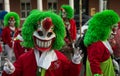 Portrait of colorful masked people parading in the street