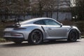 Profile view of grey Porsche 911 GT3 rs parked in the street