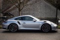 Profile view of grey Porsche 911 GT3 rs parked in the street