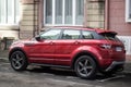 profile view of red range rover evoque parked in the street Royalty Free Stock Photo