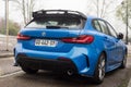 rear view of blue BMW M1 series parked in the street Royalty Free Stock Photo