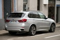 Rear view of grey BMW X3 SUV carparked in the street