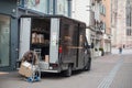 UPS delivery worker unloading packages from his truck in the street Royalty Free Stock Photo