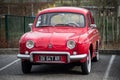 Front view of red Renault Dauphine vintage parked in the street