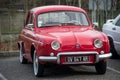 Front view of red Renault Dauphine vintage parked in the street