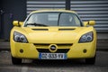 Front view of yellow Opel Speedster roadster of parked in the street