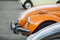 closeup of orange old Volkswagen beetle parked in the street Royalty Free Stock Photo