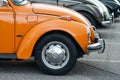 Closeup of orange old Volkswagen beetle parked in the street Royalty Free Stock Photo