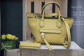 Yellow leather handbag by Longchamp in a luxury fashion store showroom Royalty Free Stock Photo