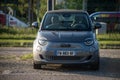 ront view of grey electric Fiat 500 parked in the street