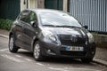 Front view of grey Toyota Yaris parked in the street