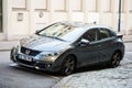 Front view of new grey Honda Civic parked in the street